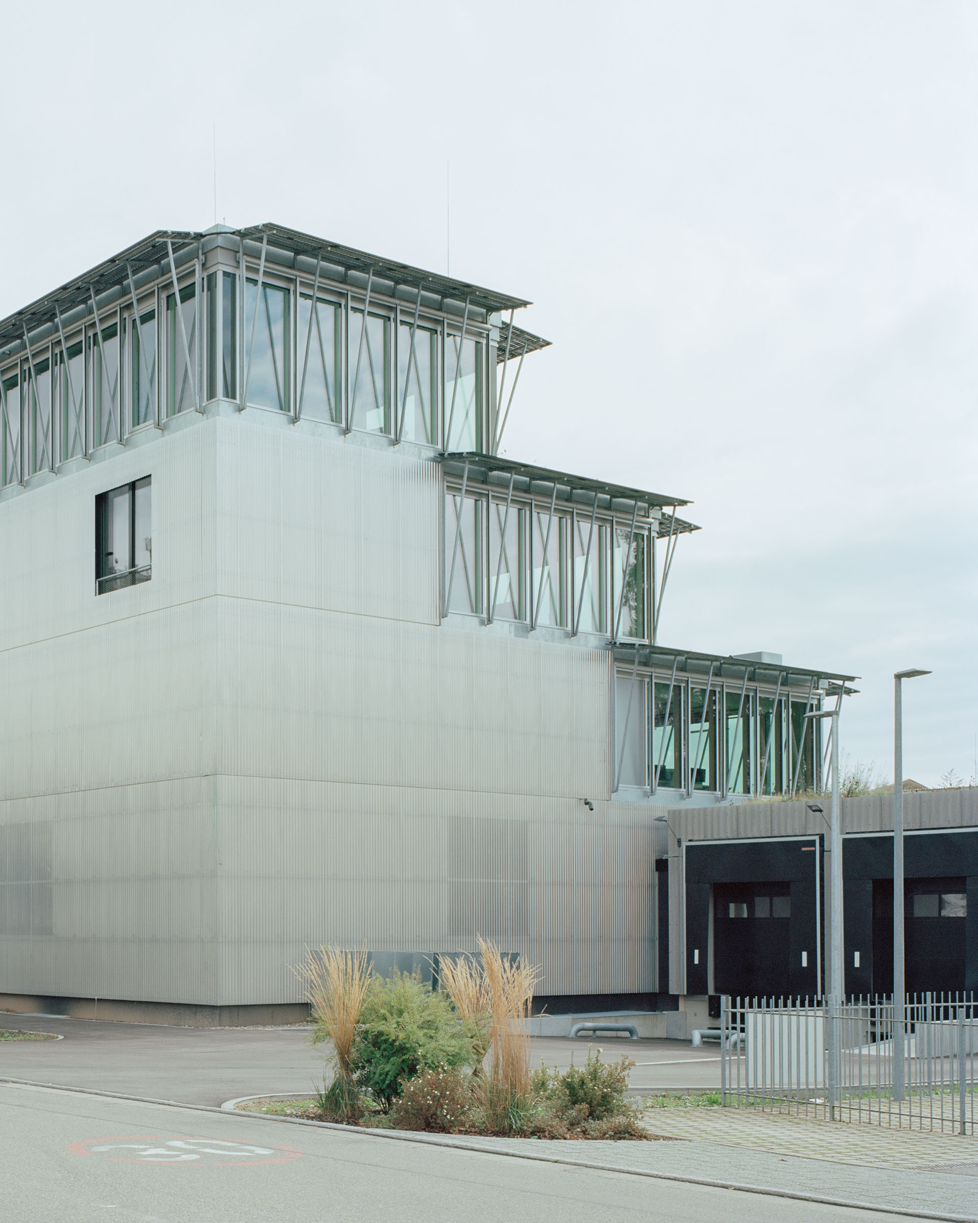 Analog architectural photography and documentation of the exterior of the Lab02 building in Lörrach, Germany, designed by Mulder Zonderland. Photographed by Piotr Hraptovich, architectural photographer based in Basel, Switzerland. Analoge Architekturfotografie und Dokumentation der Aussensicht des Lab02 Gebäudes in Lörrach, Deutschland, entworfen von Mulder Zonderland. Fotografiert von Piotr Hraptovich, Architekturfotograf mit Sitz in Basel, Schweiz. 