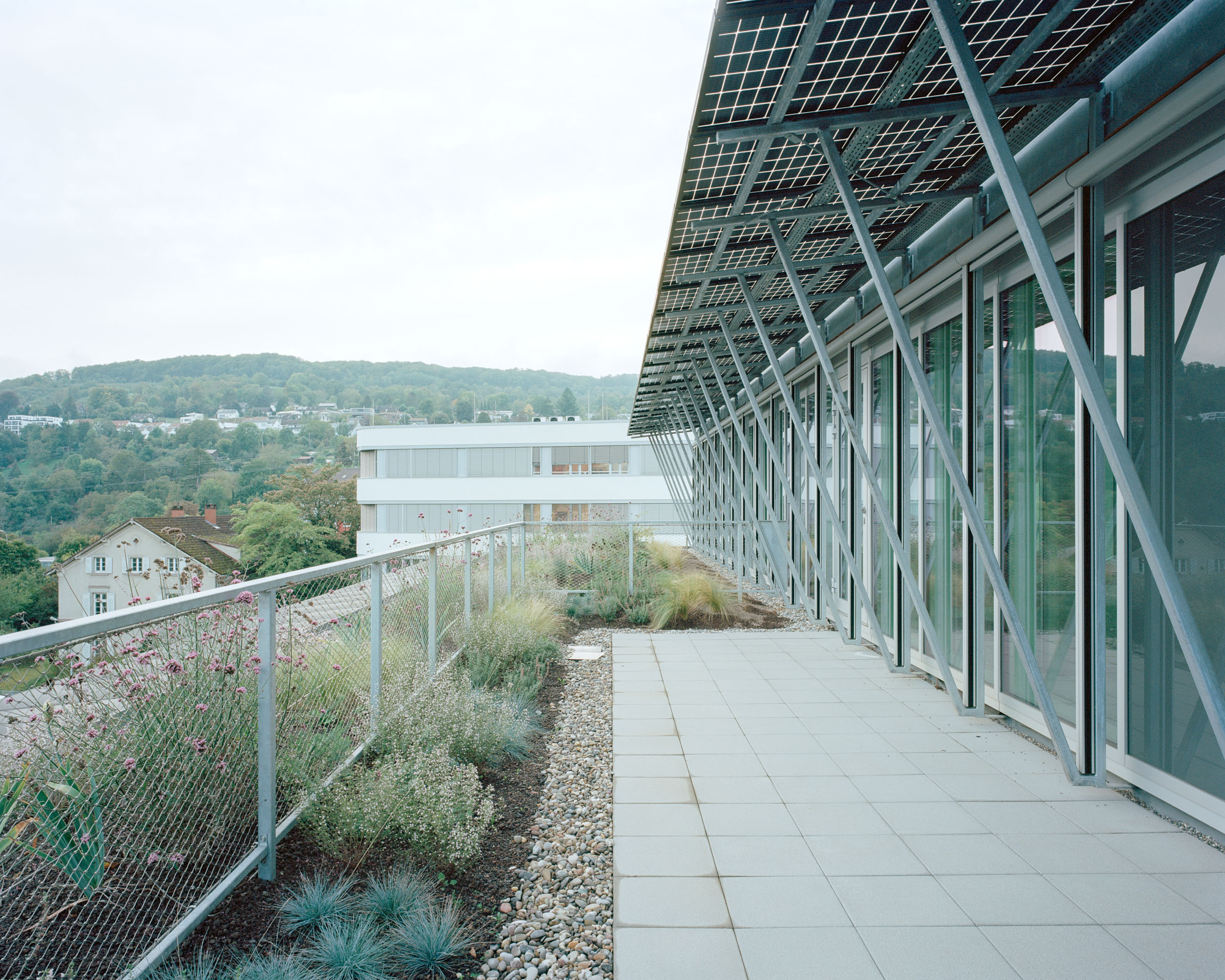 Analog architectural photography and documentation of the exterior of the Lab02 building in Lörrach, Germany, designed by Mulder Zonderland. Photographed by Piotr Hraptovich, architectural photographer based in Basel, Switzerland. Analoge Architekturfotografie und Dokumentation der Aussensicht des Lab02 Gebäudes in Lörrach, Deutschland, entworfen von Mulder Zonderland. Fotografiert von Piotr Hraptovich, Architekturfotograf mit Sitz in Basel, Schweiz. 